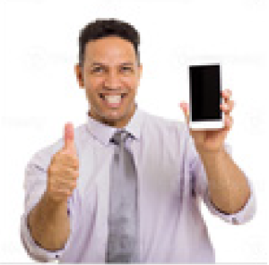 A man in a tie is holding a cell phone and giving a thumbs up.