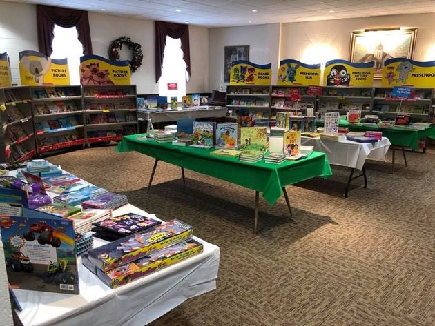 a library filled with lots of books and toys