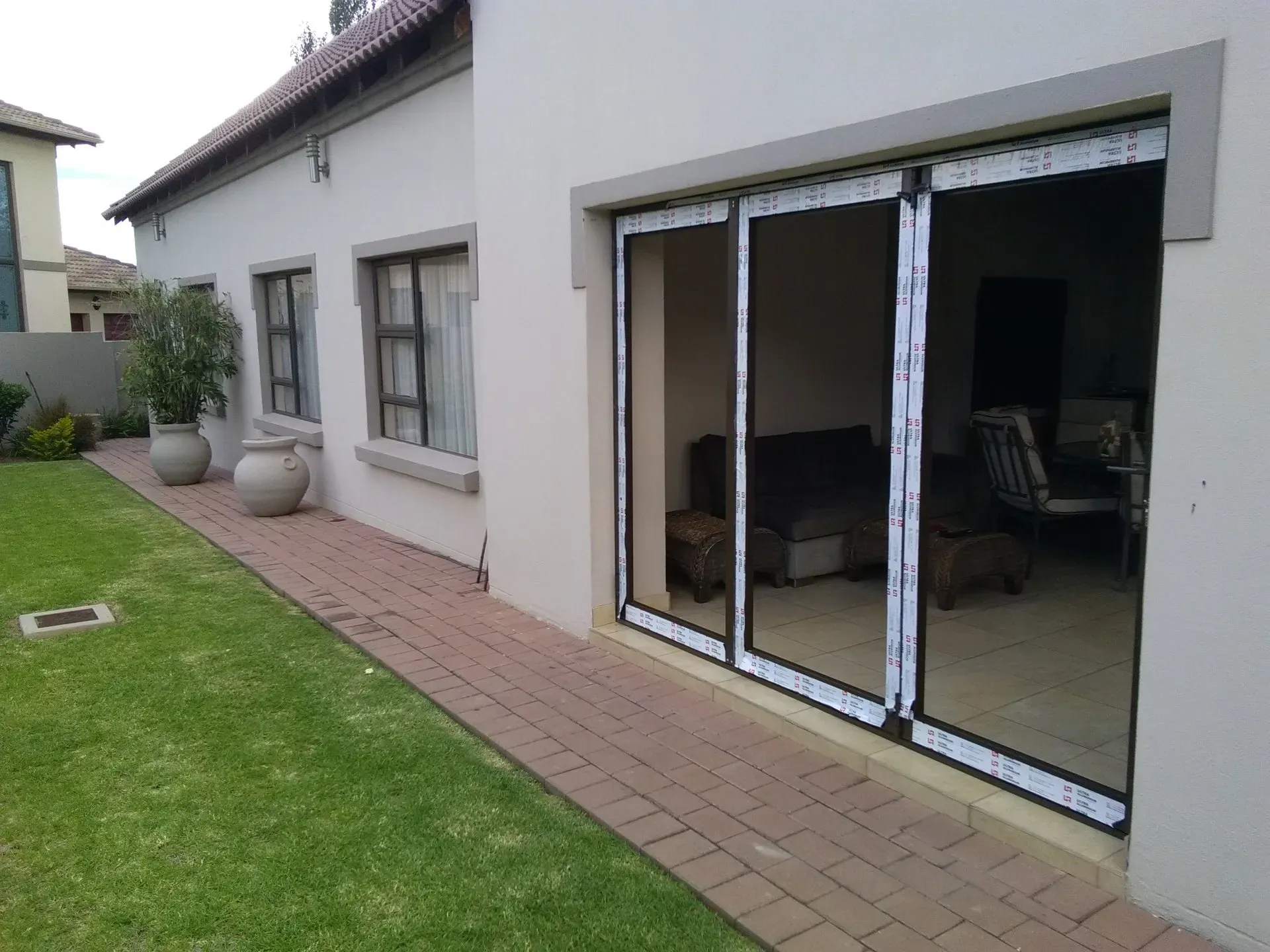 A house with a lot of windows and sliding glass doors