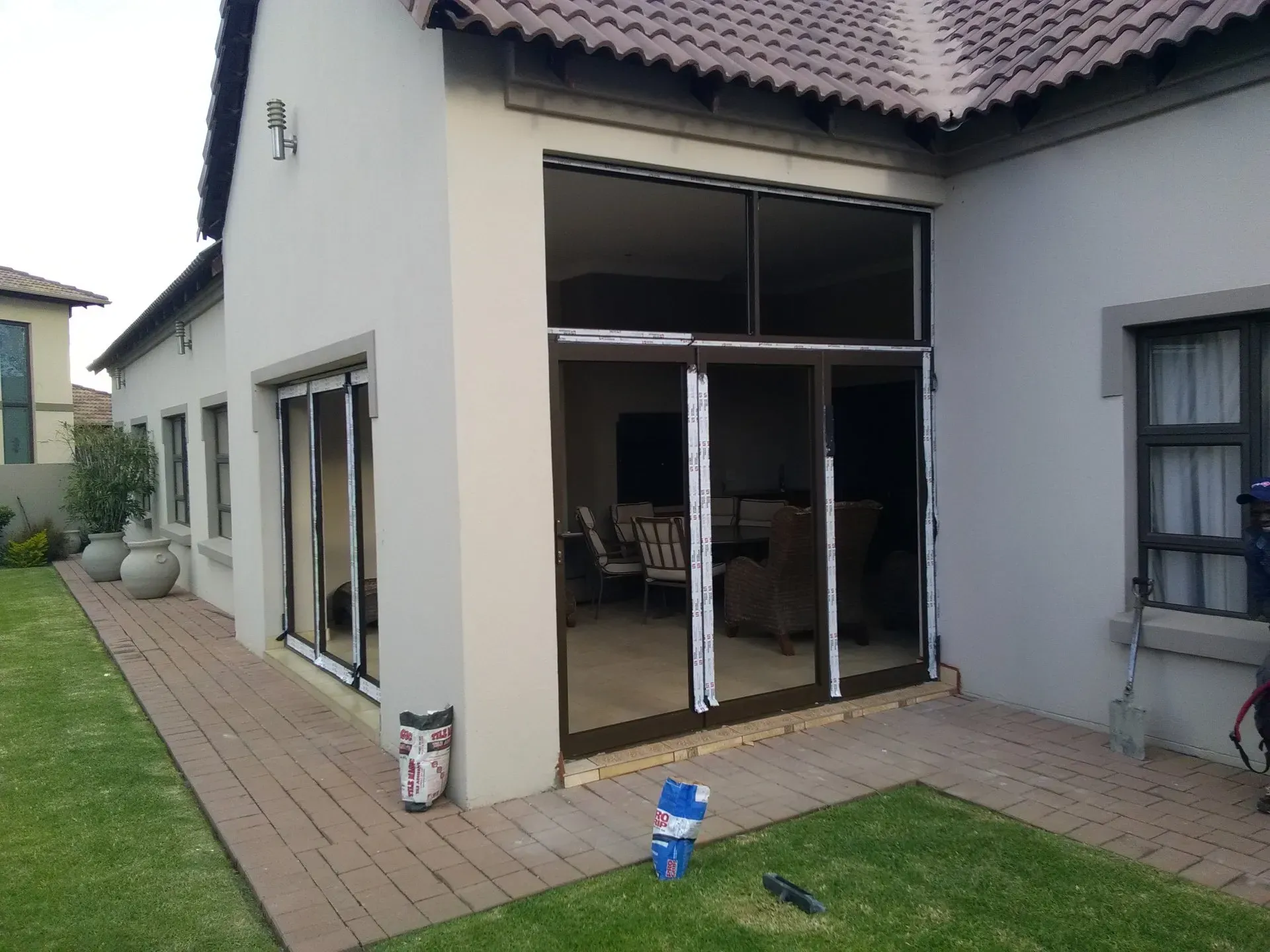 A house with a patio and sliding glass doors