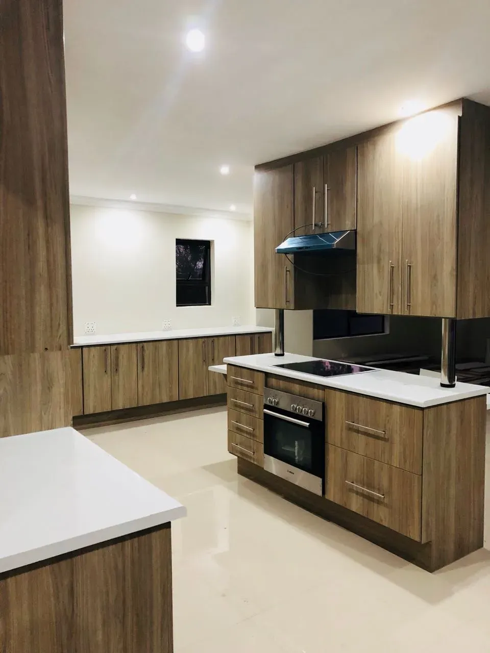 A kitchen with wooden cabinets and stainless steel appliances