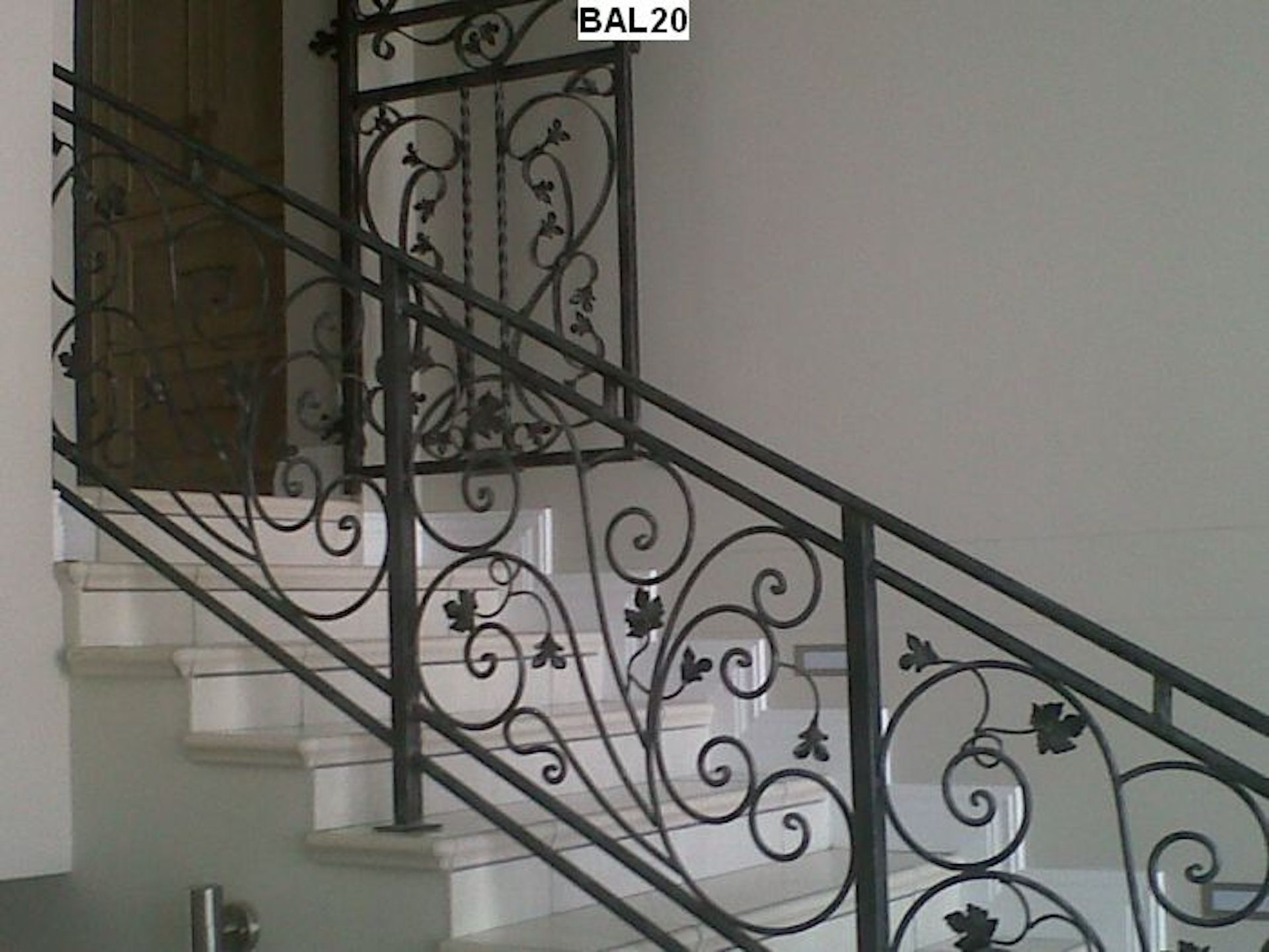 A wrought iron railing on a set of stairs