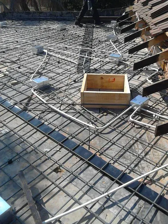 A wooden box is sitting on top of a concrete floor.