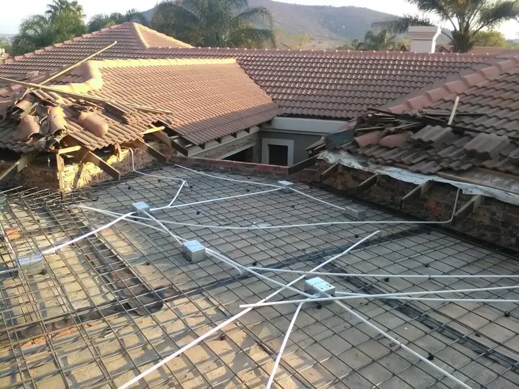 A roof with a lot of wires on it
