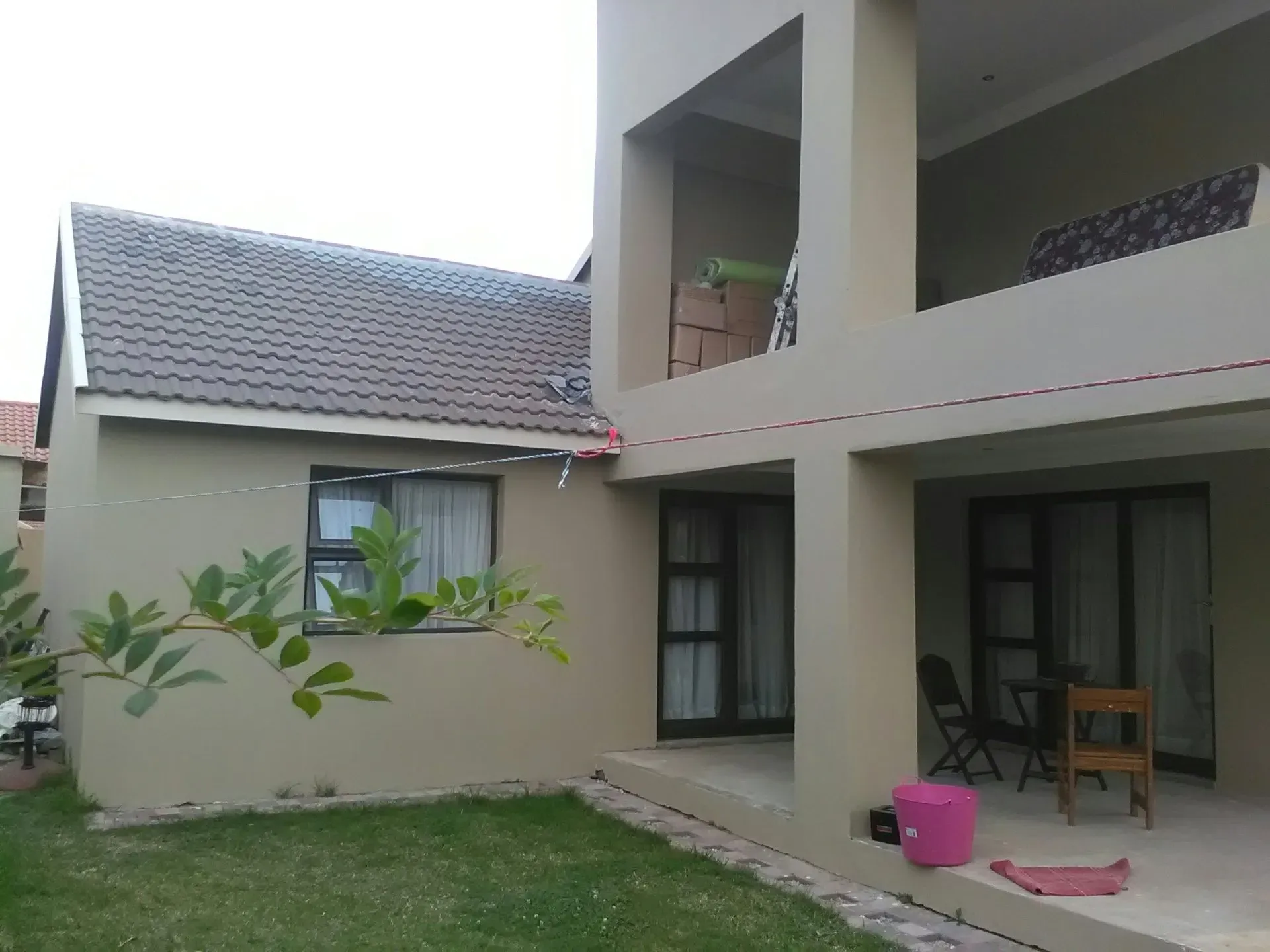 A large house with a lawn in front of it