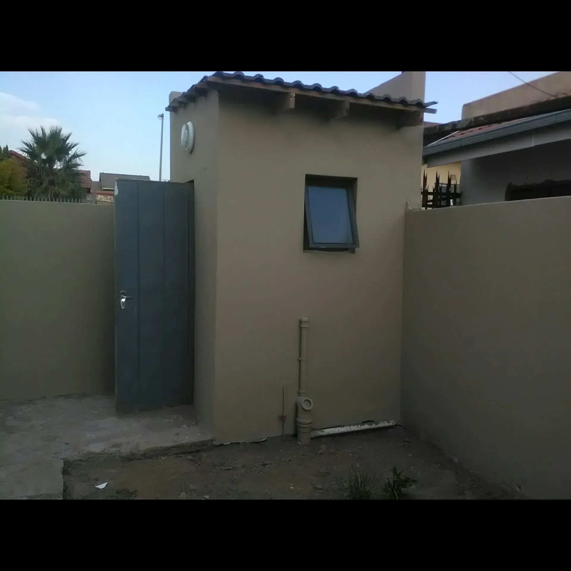 A small building with a window and a door