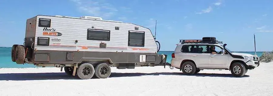 4WD Towing Caravan On The Beach — AEQ - Auto Electrics QLD in Woombye, QLD