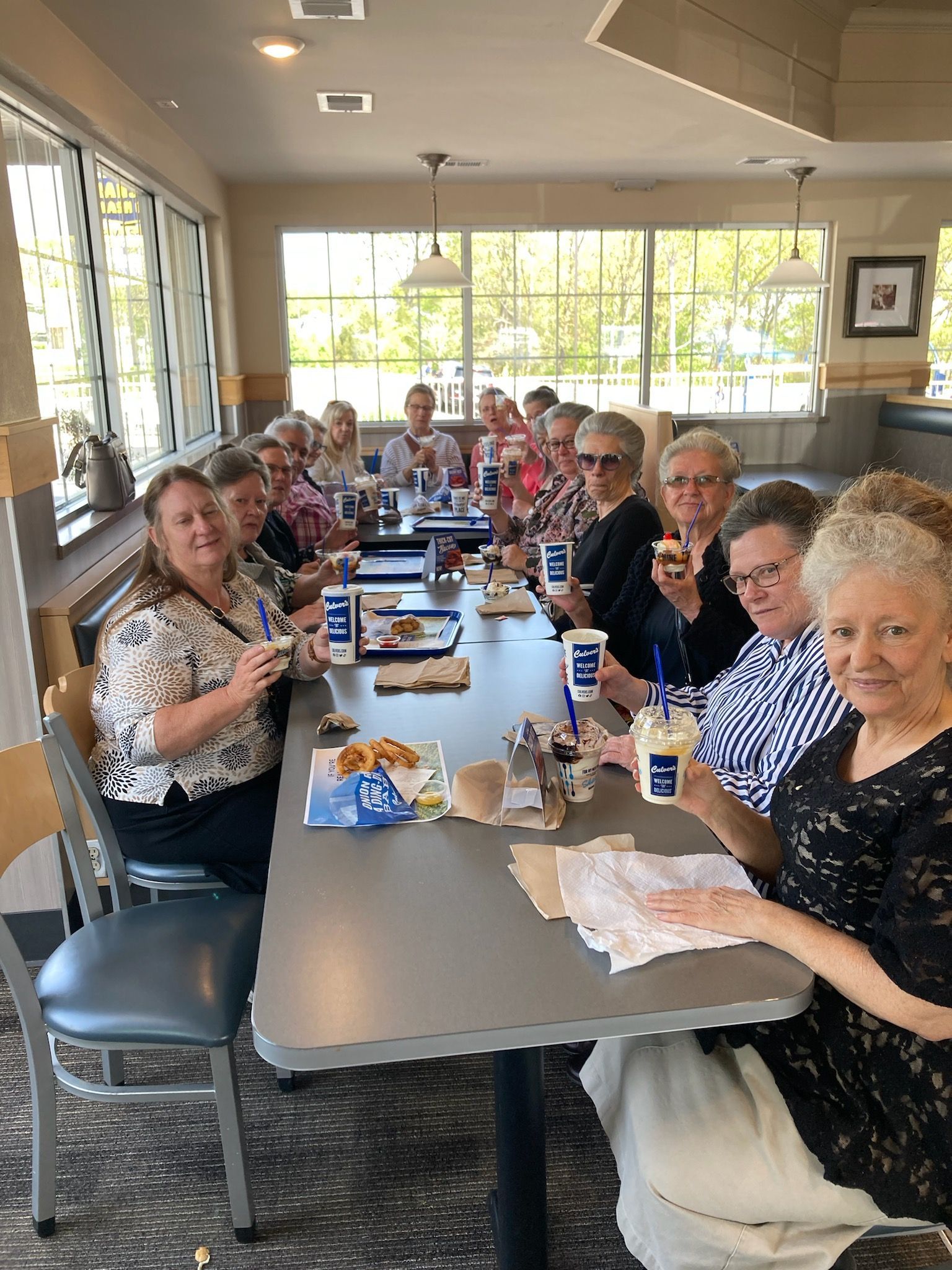 group gathered at restaurant for photo op