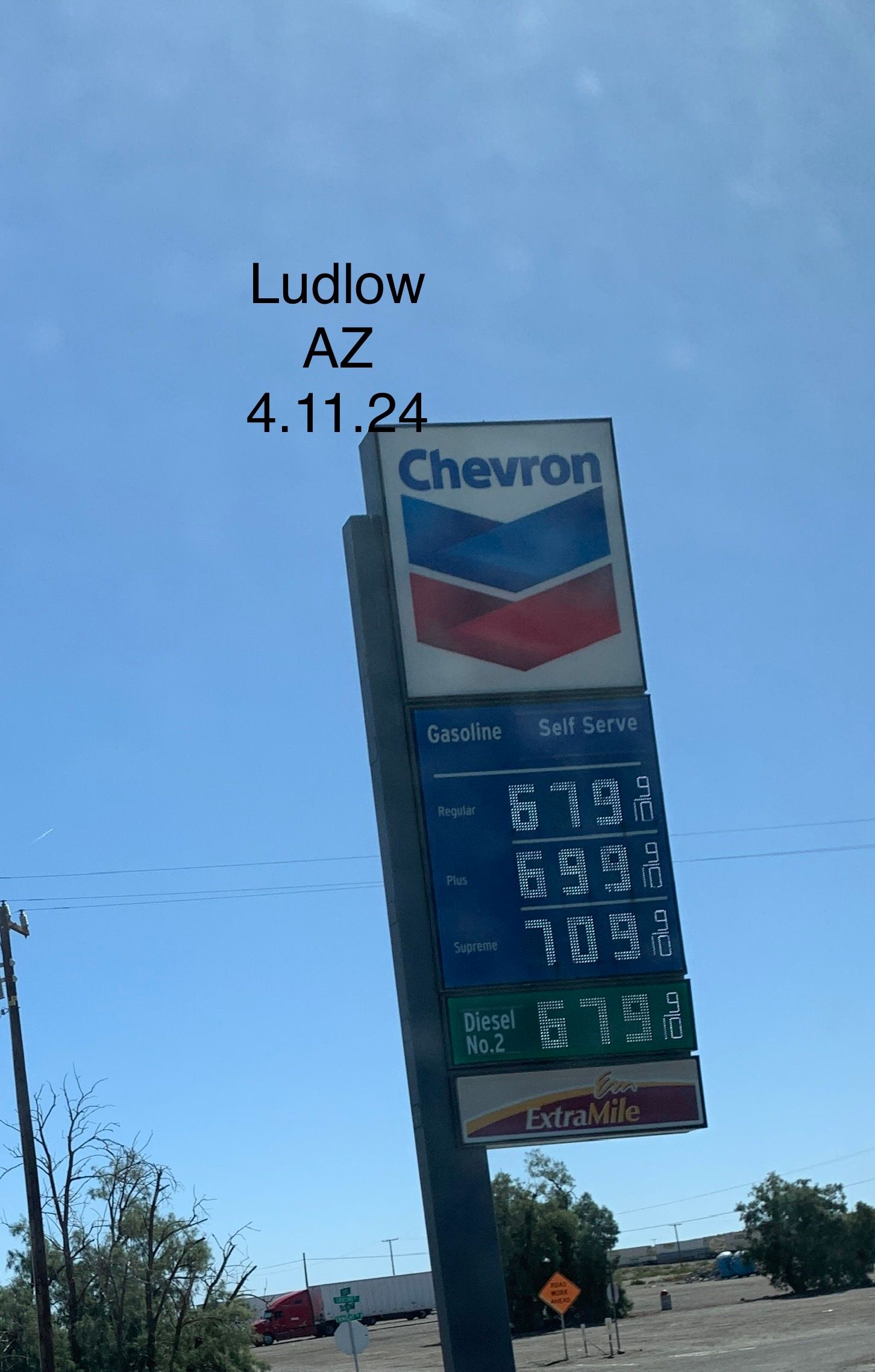 tall gasoline station sign HIGH GAS PRICES on display