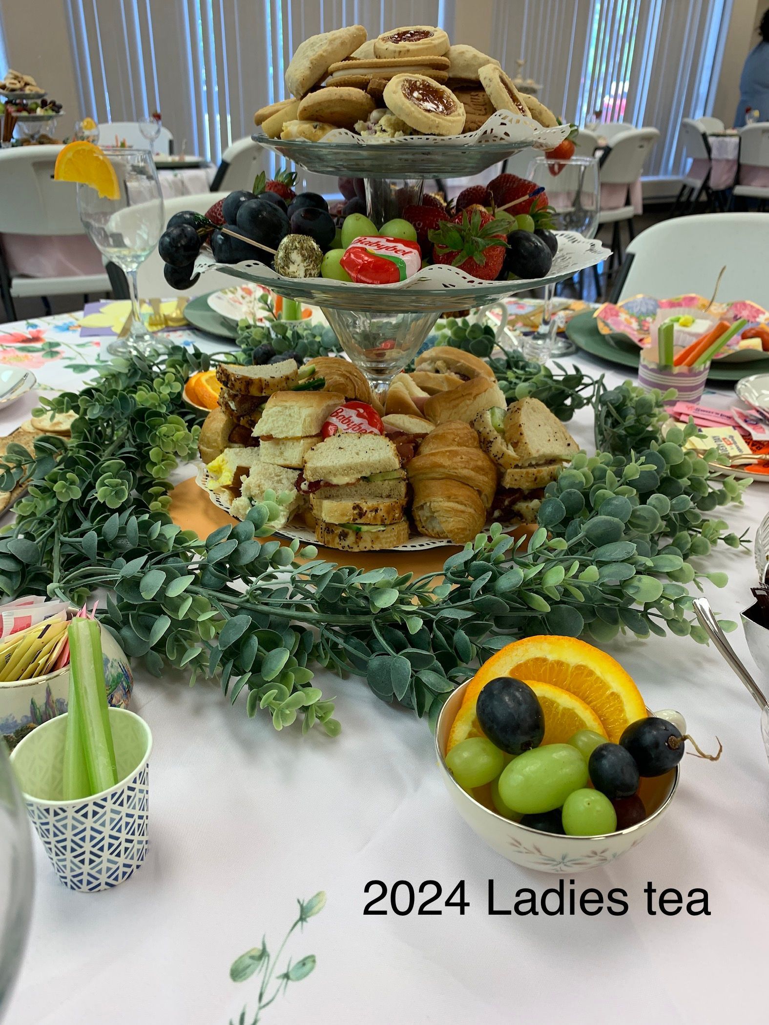 A table topped with a variety of food and a bowl of fruit.
