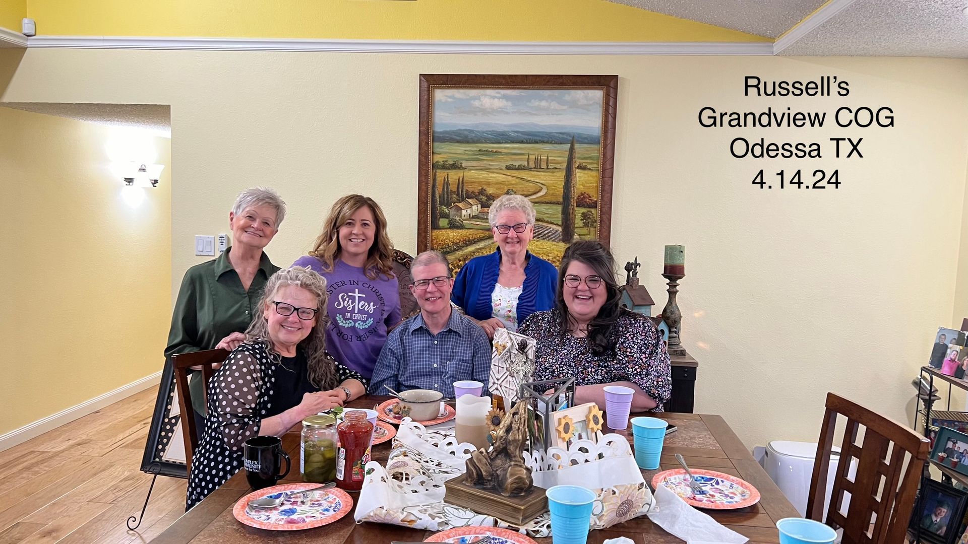 group of people posing after a big meal