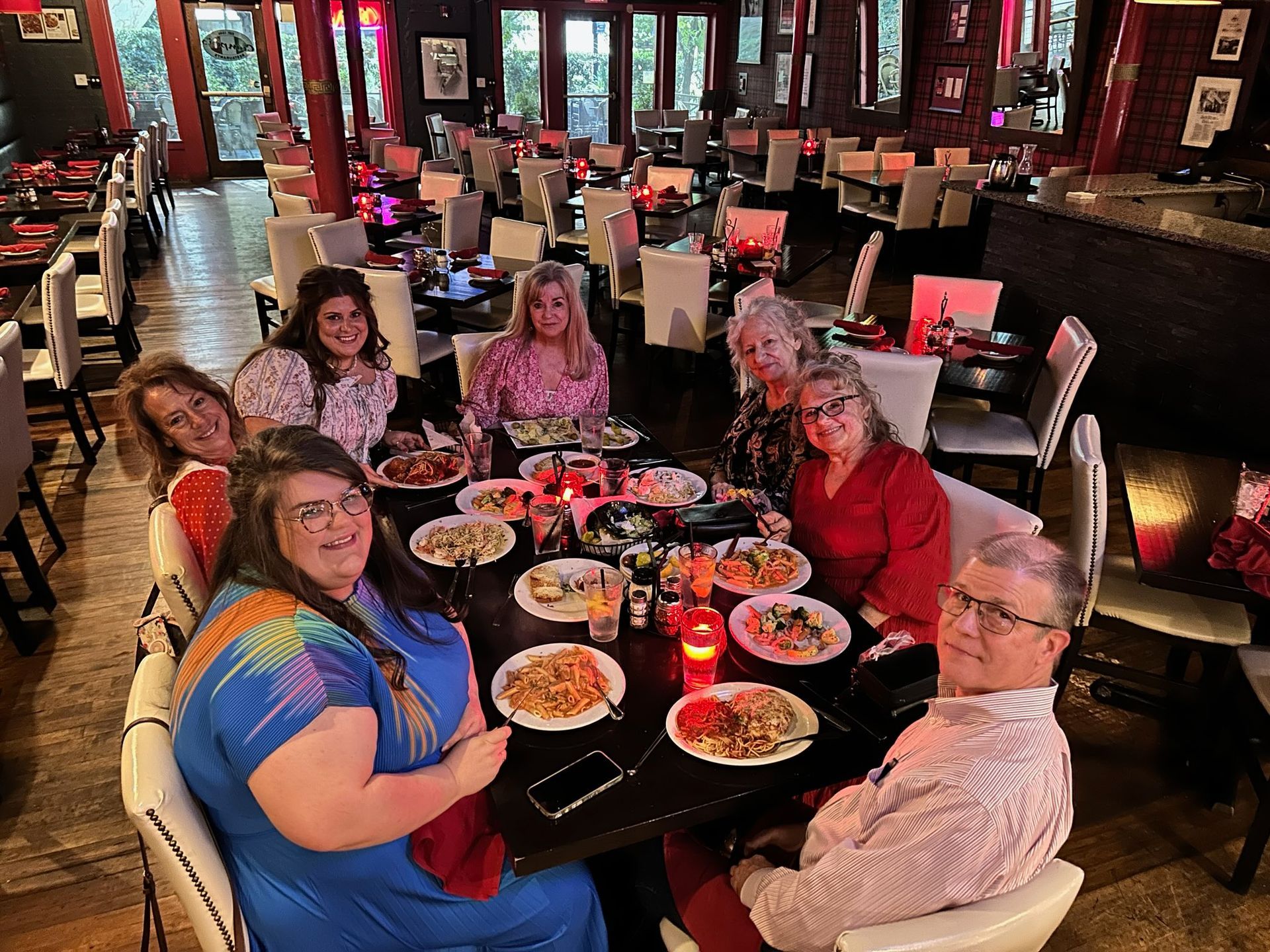 group gathered around photo op at restaurant