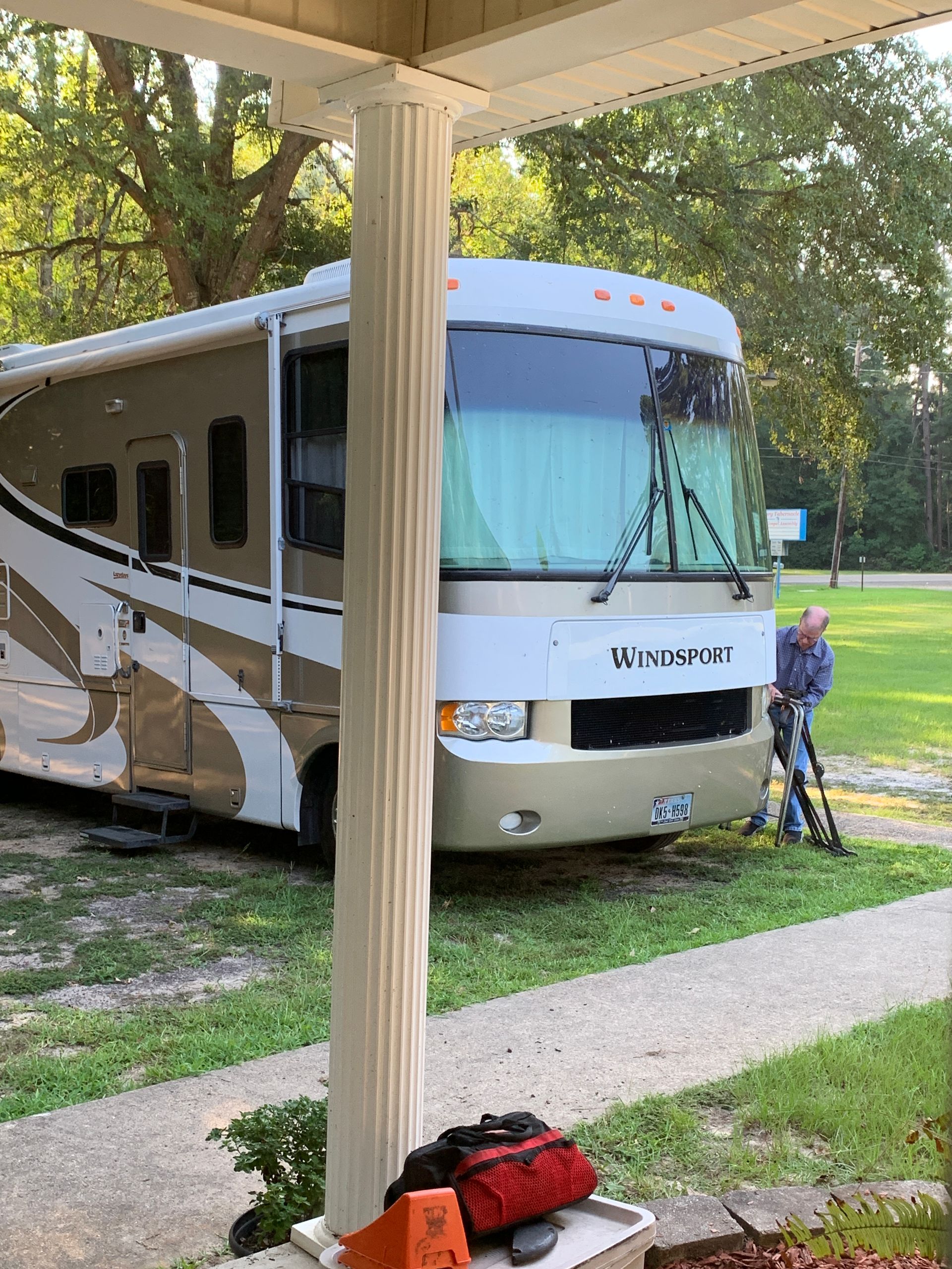 RV PARKED at a church and man loading equpment
