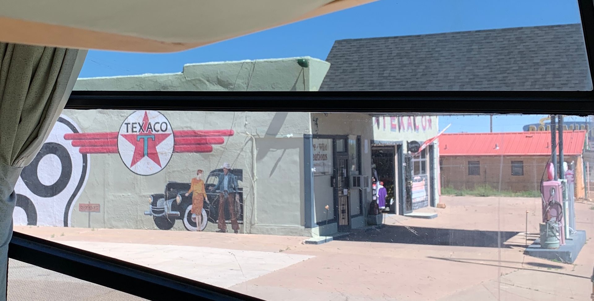 A view of a texaco gas station through a window