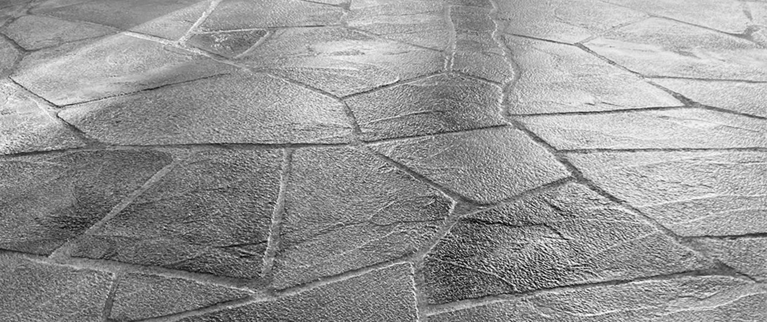 Gray stone pavers with irregular shapes.