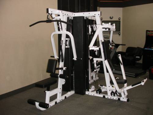 A black and white gym machine in a room