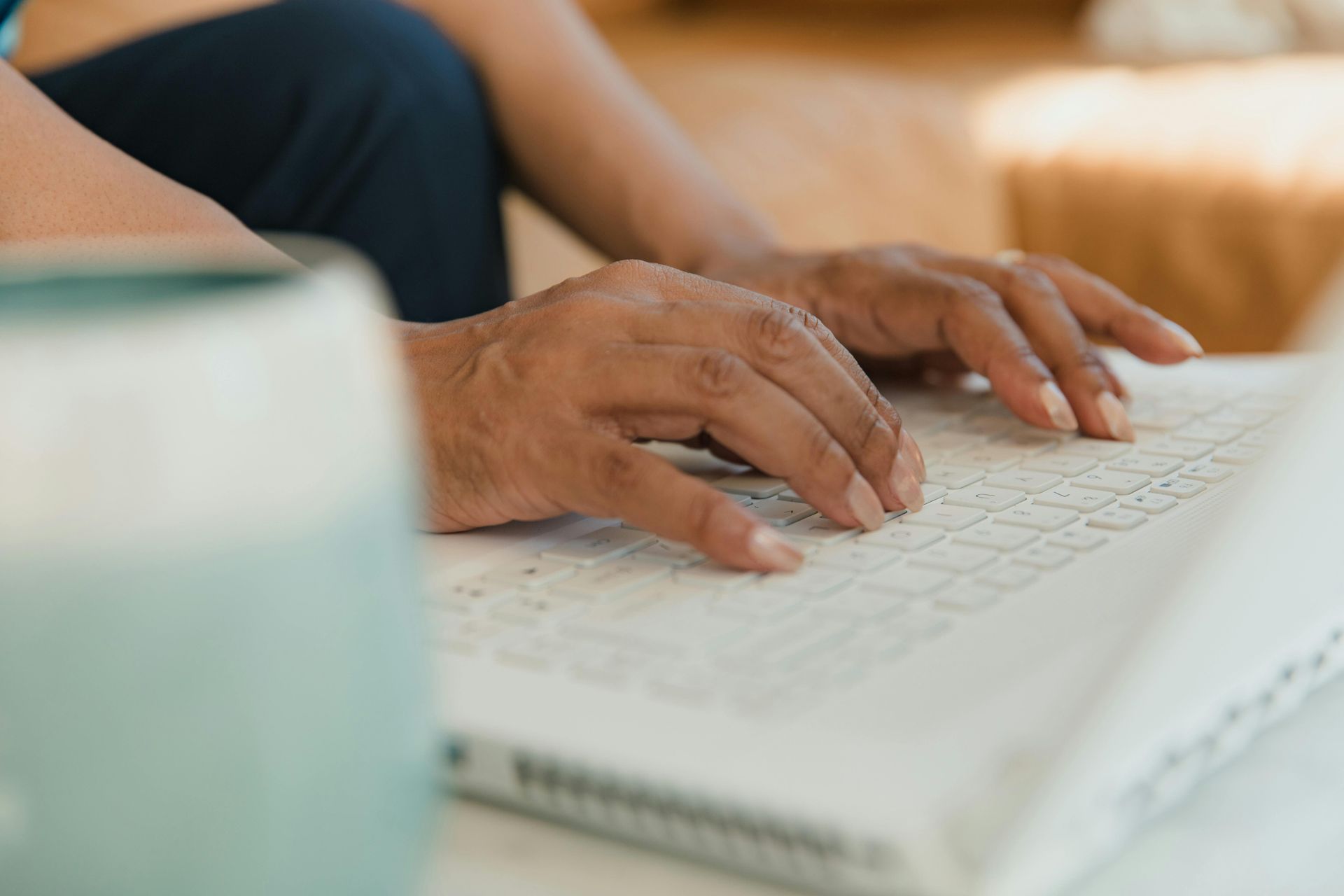 Hands on a laptop