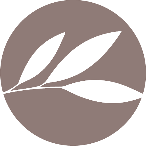 A white leaf is in a brown circle.