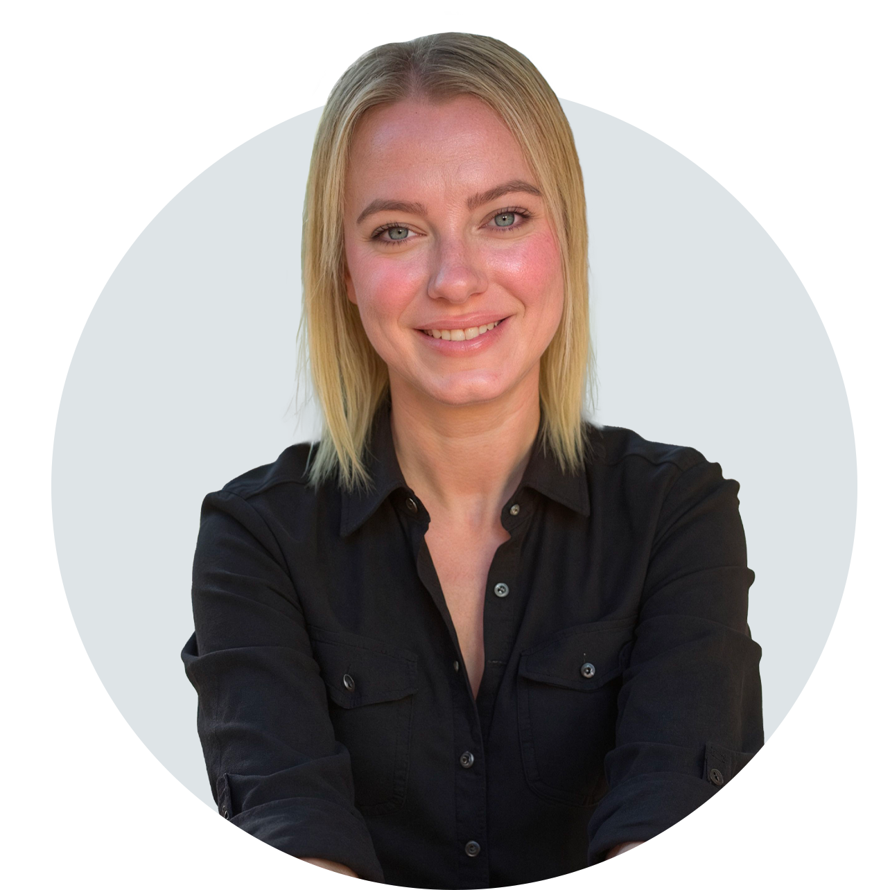 A blonde woman, smiling, in a black collared shirt.