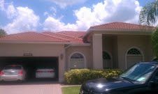 Residential — House Front With Three Cars  in Myers, FL