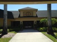 Roof — Front View House With Greenish Gray Paint Roof  in Myers, FL