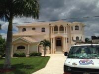 Roof Cleaning — White Paint House With Car in Front in Myers, FL