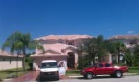 Lee County Pool Cleaning — Two car in Front Of The House in Myers, FL