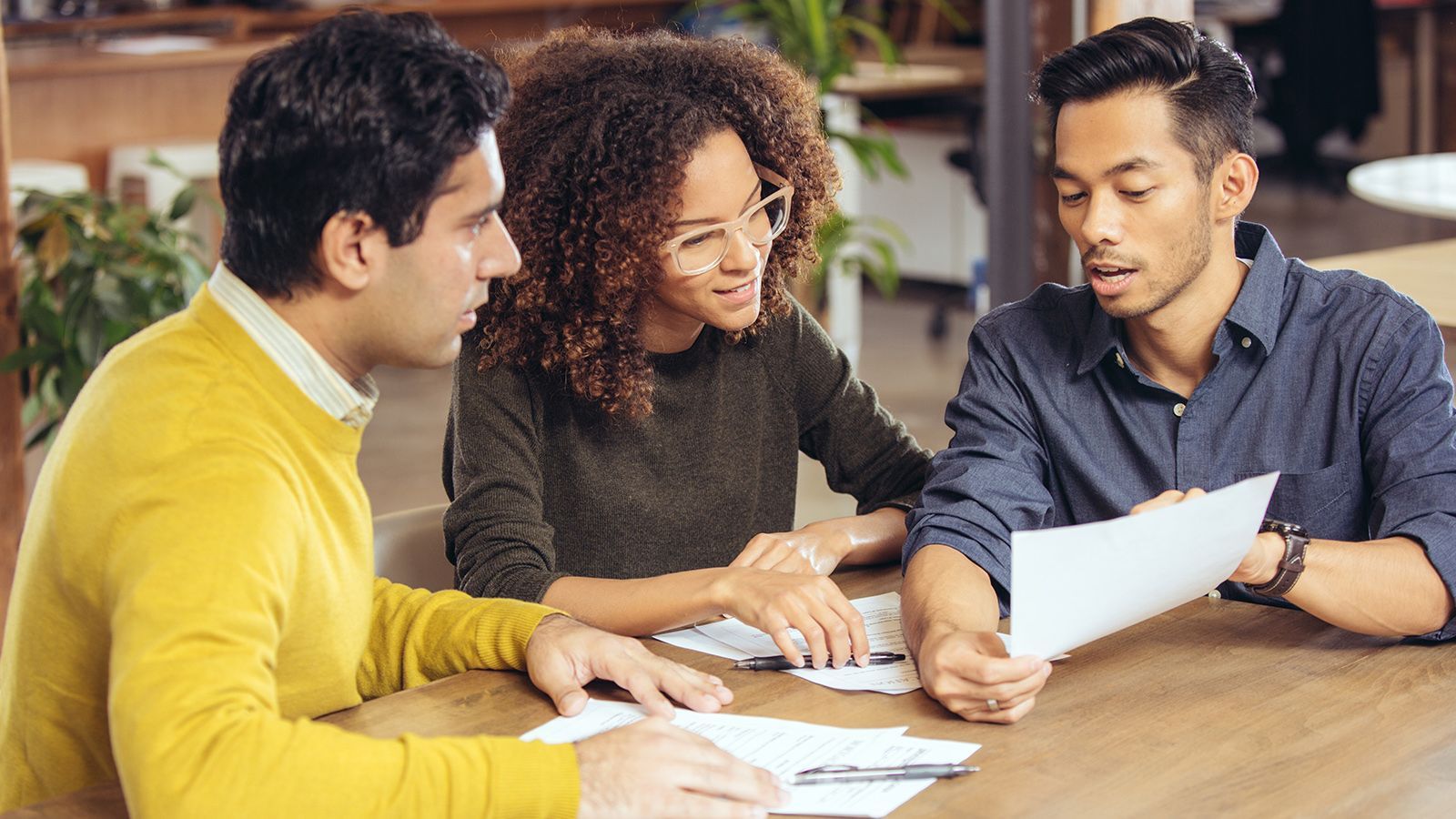 Couple reviewing documents with a REALTOR