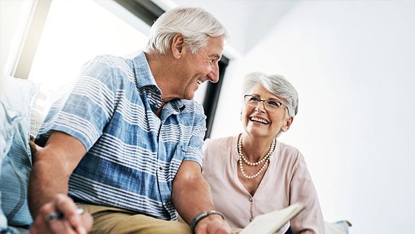 Senior couple discussing documents