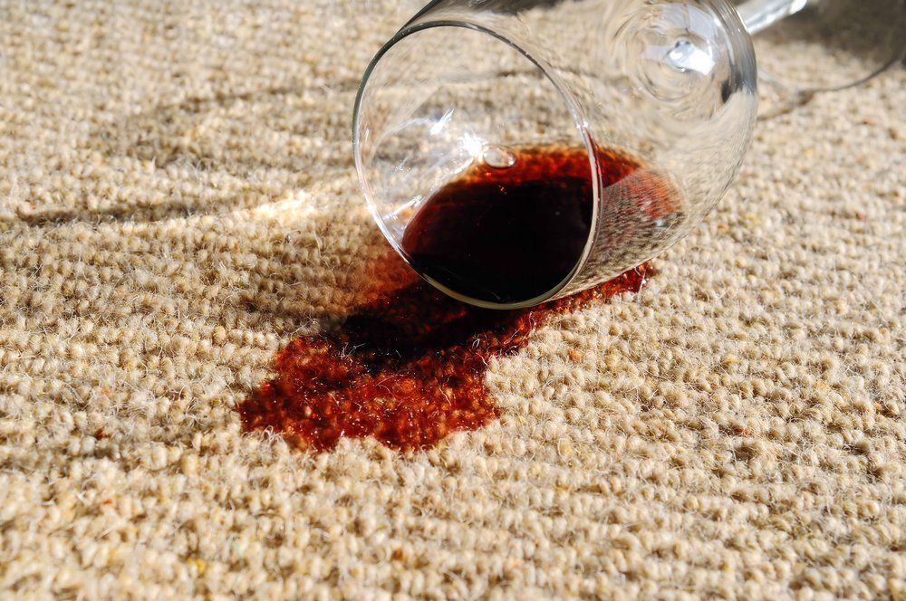 Red wine stain on carpet.