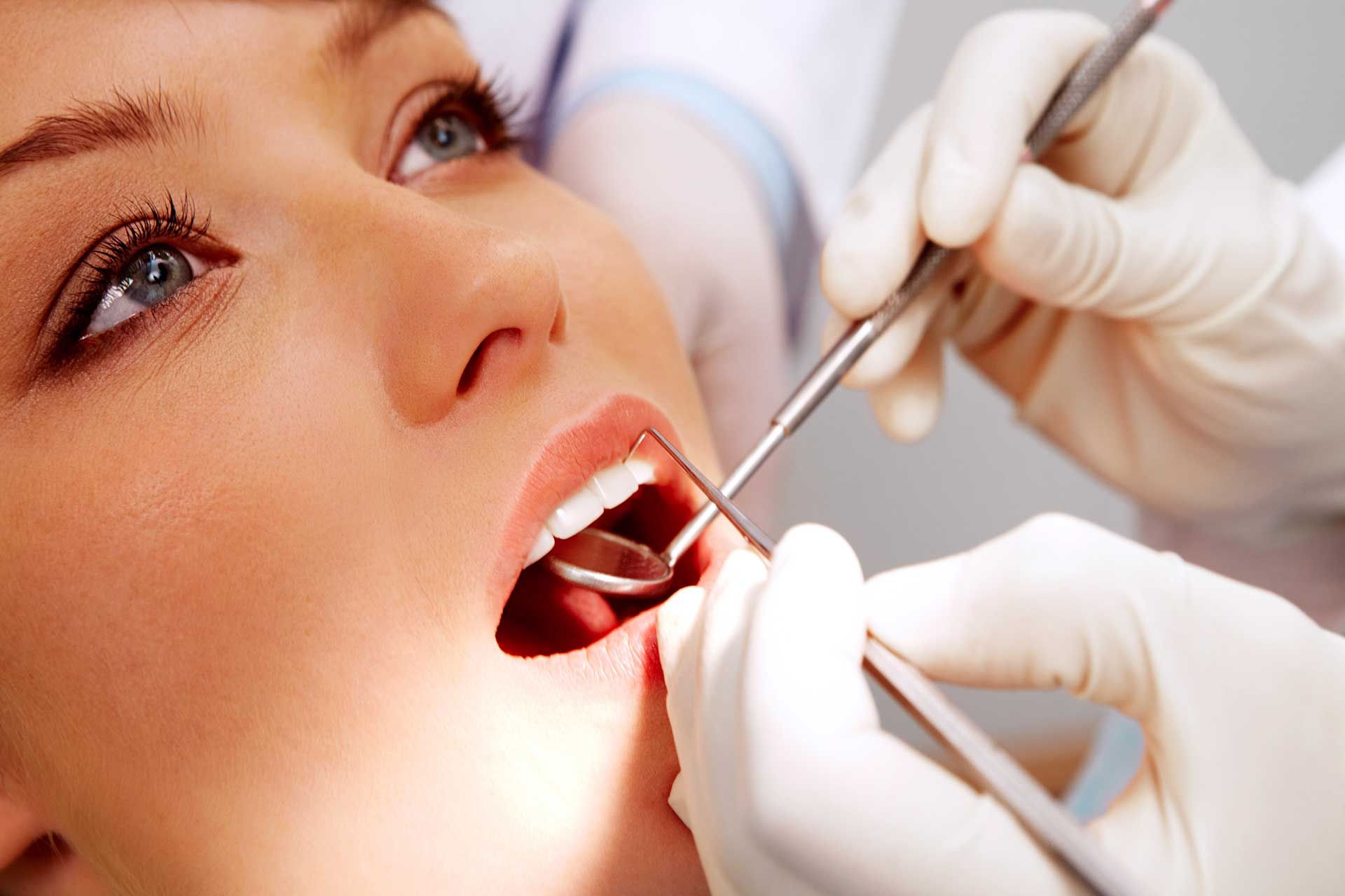 Woman at dental clinic, highlighting services provided by a trusted general dentist.