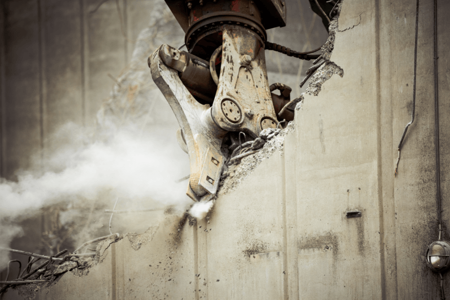 concrete demolition with excavator