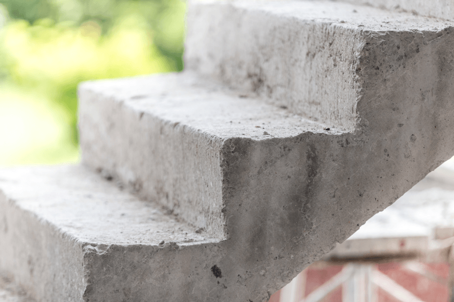 concrete stairs with grass in the background