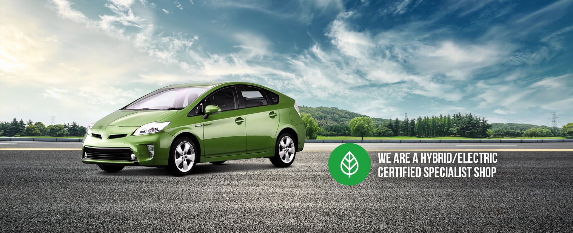Green hybrid car on a road under a blue sky, text: "We are a hybrid-electric certified specialist shop". | Golden Gear Automotive