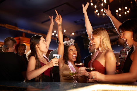 Four women celebrating at a bachelorette party.