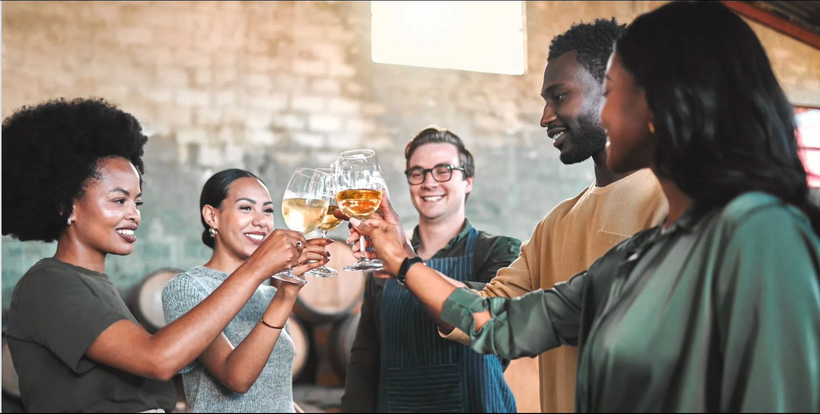 Several people enjoying a distillery tour with samples