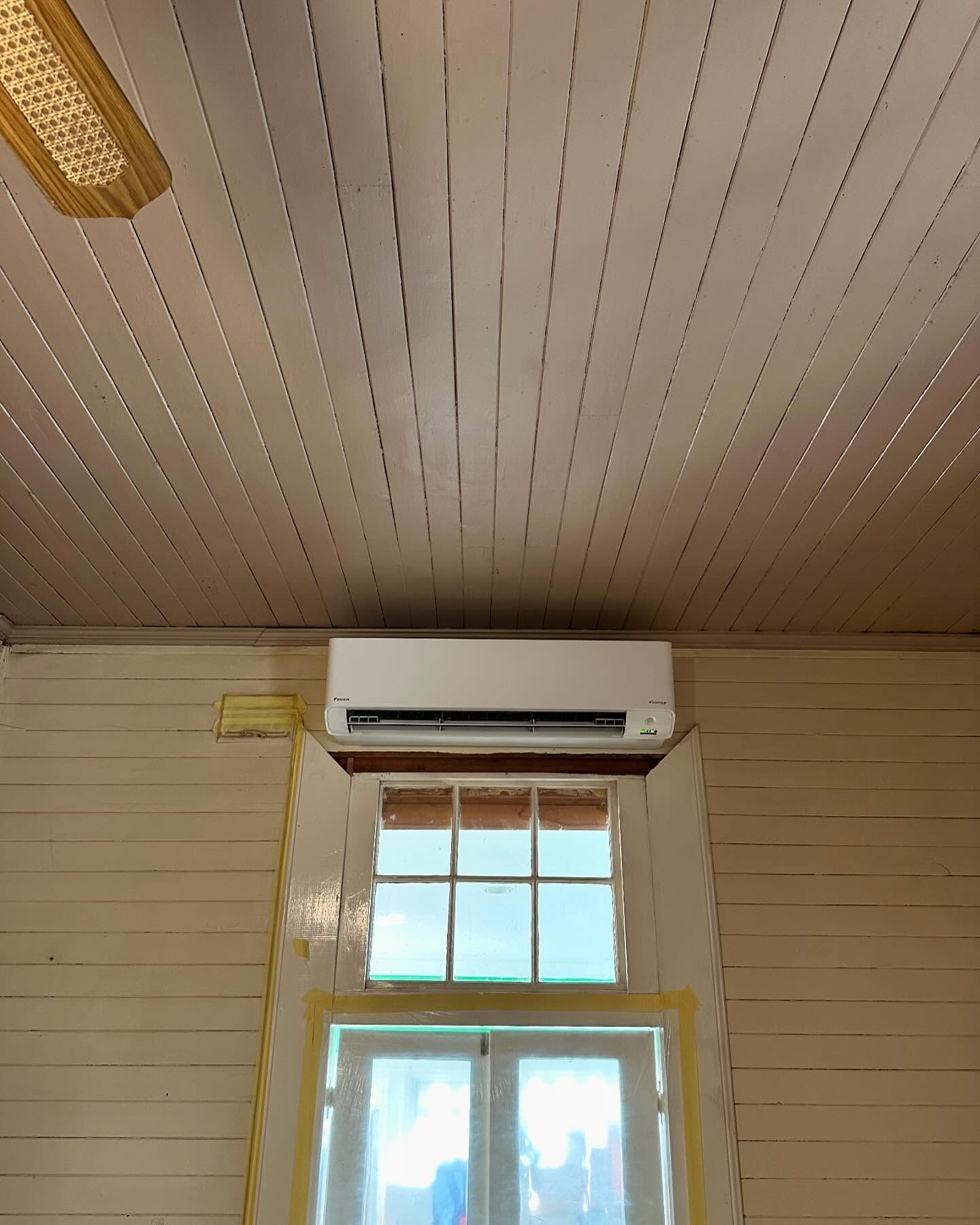 White Air Conditioner Above a Window in A Room — Canobolas Air in Dubbo, NSW