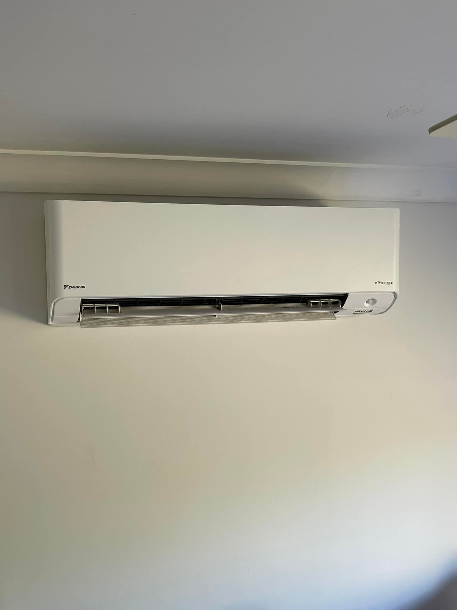 White Air Conditioner Mounted on A White Wall — Canobolas Air in Cowra, NSW
