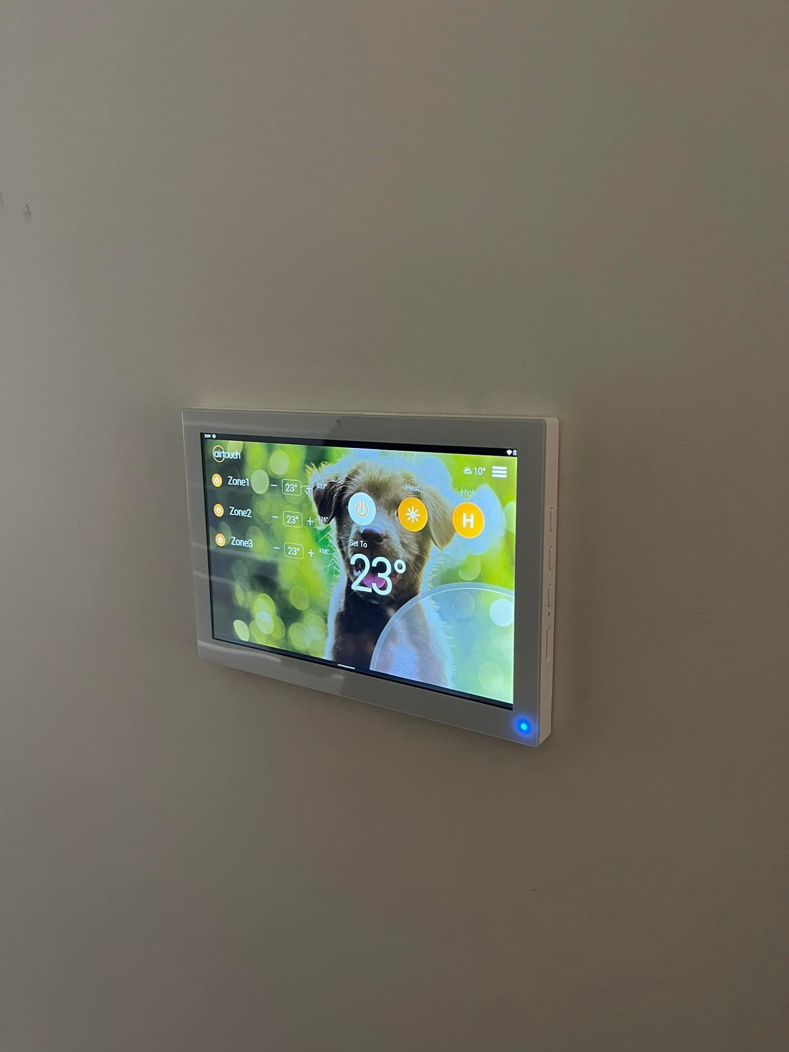 White Tablet on Wall Displaying Dog Photo — Canobolas Air in Dubbo, NSW