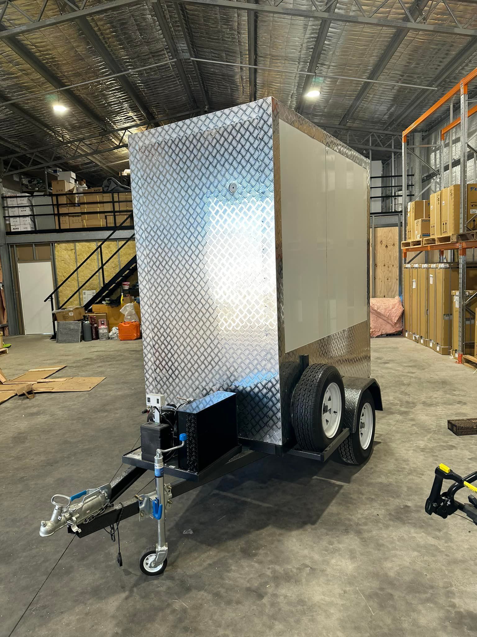 Silver Enclosed Trailer in A Warehouse Setting — Canobolas Air in Oberon, NSW