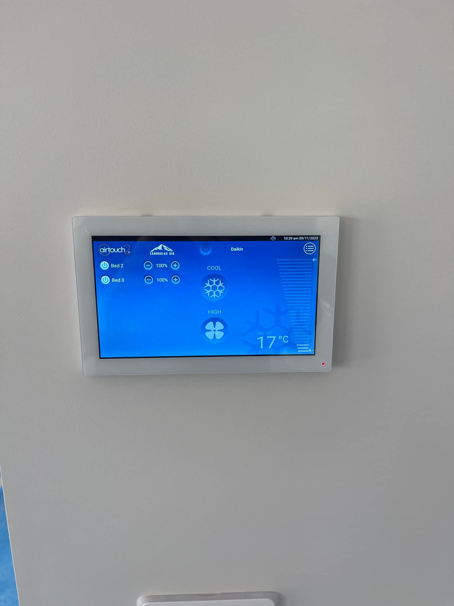 White Wall-Mounted Touch Screen Displaying Climate Control Settings — Canobolas Air in Oberon, NSW