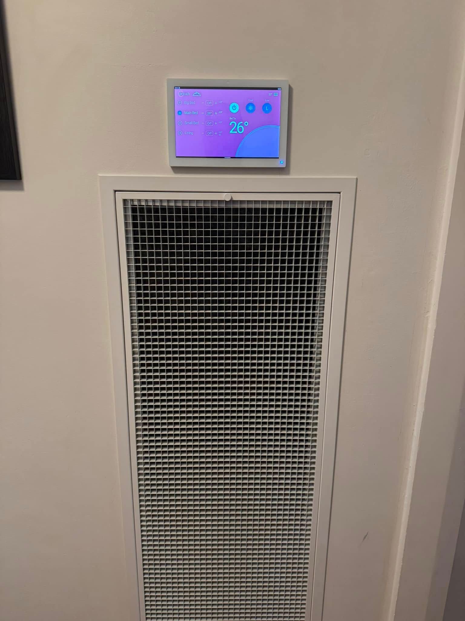 White Wall with A Digital Thermostat Above a Large Vent — Canobolas Air in Mudgee, NSW