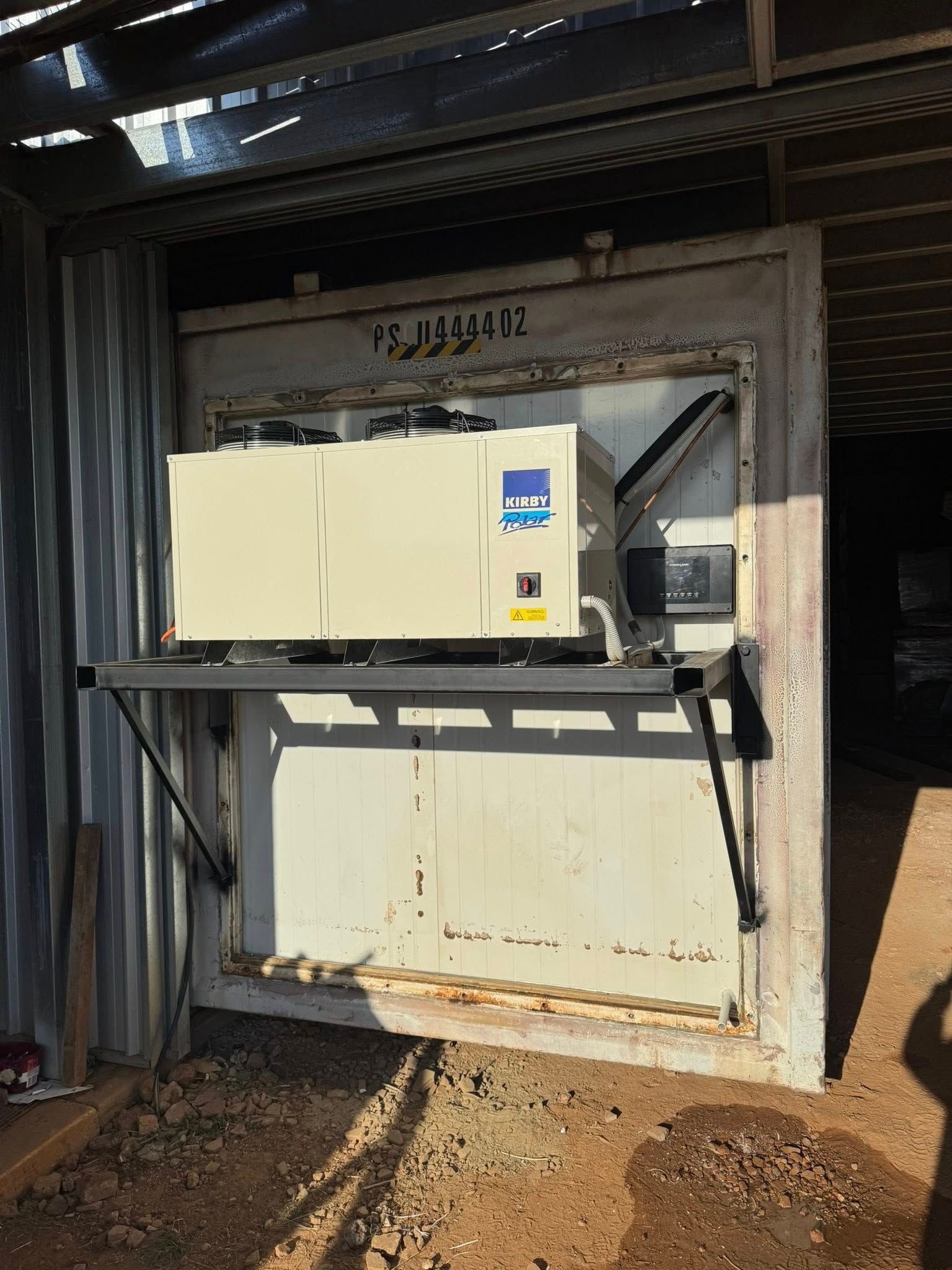 White Refrigeration Unit Mounted on The Front of A Cargo Container — Canobolas Air in Parkes, NSW