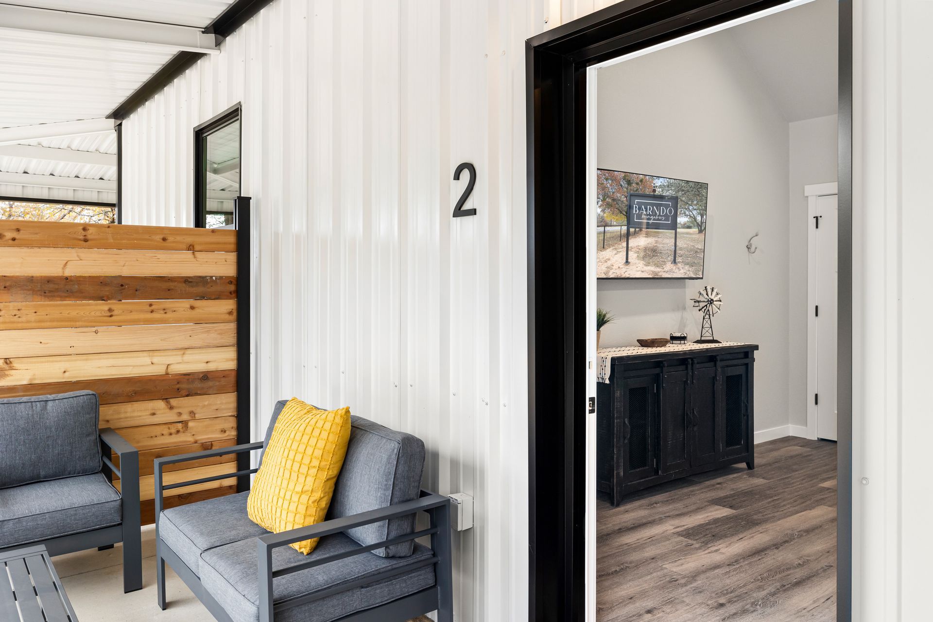 A living room with a couch , chair , and table.