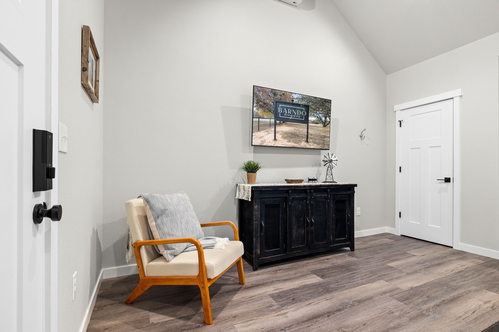 There is a chair and a dresser in the room.