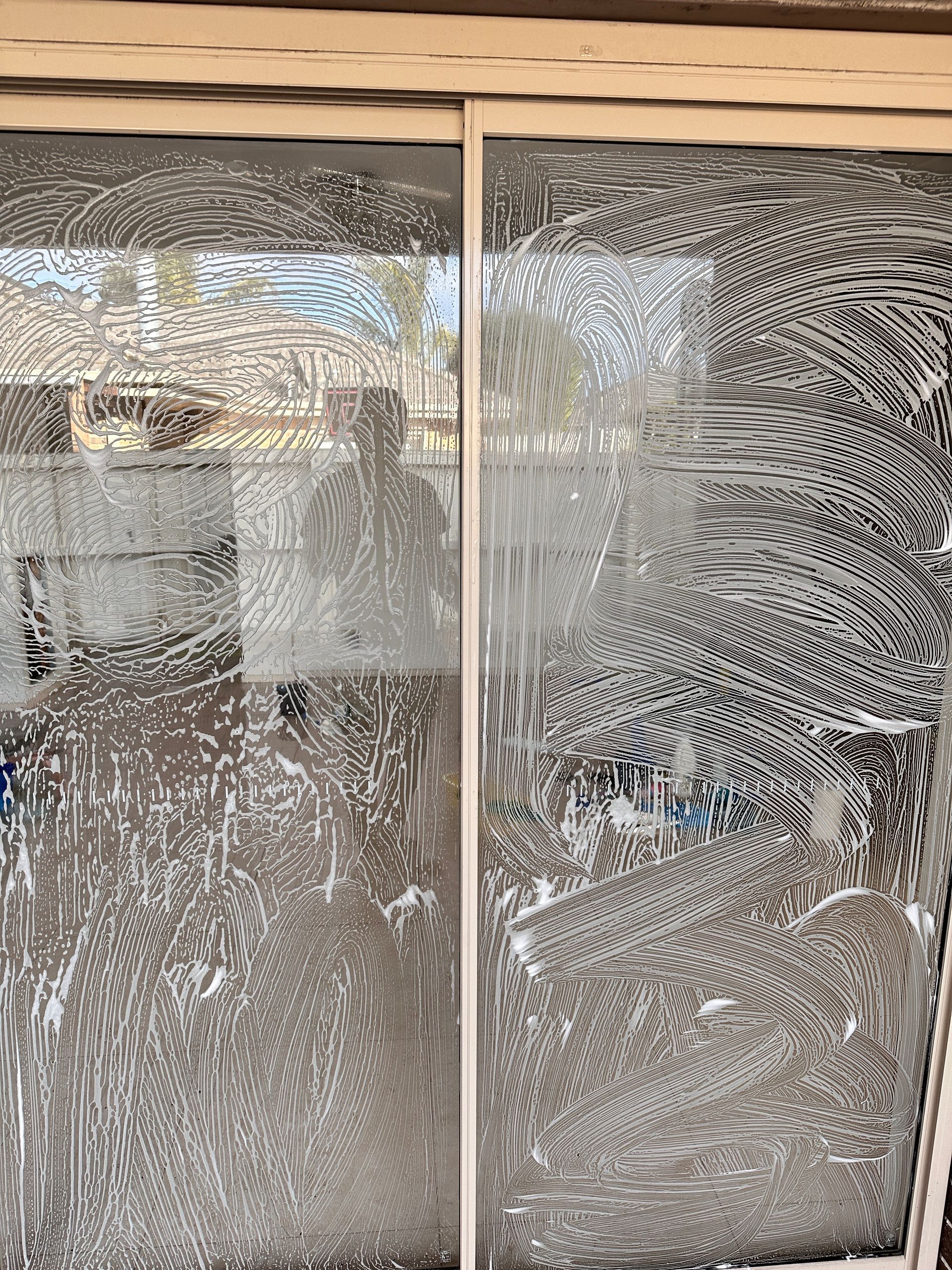 A close up of a window with a lot of soap on it.