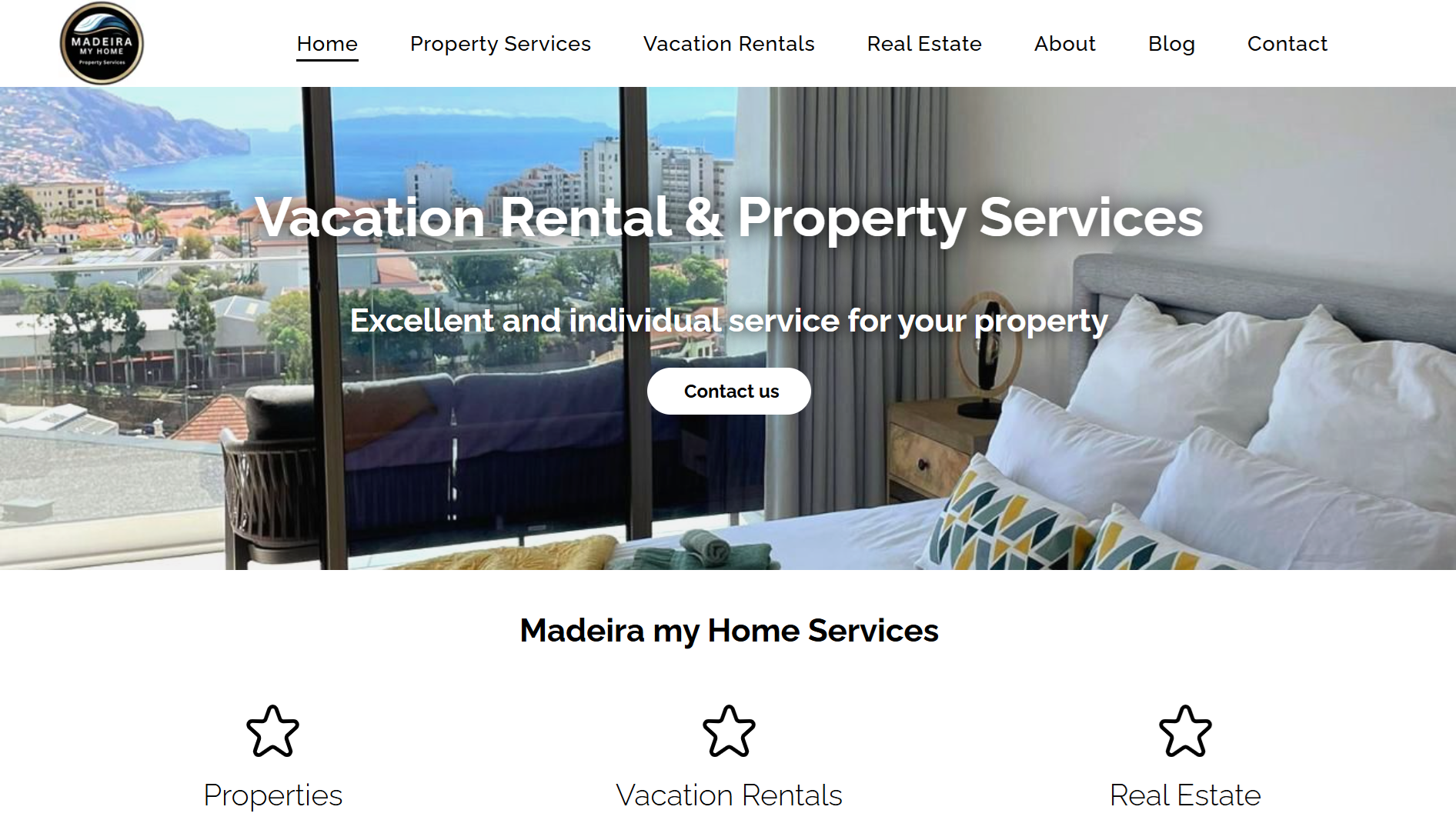 A vacation rental and property services website shows a bedroom with a view of the ocean.