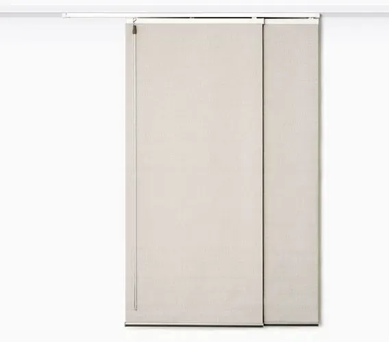 Solar thermal panel on a gray-shingled roof above open skylights against a clear blue sky.