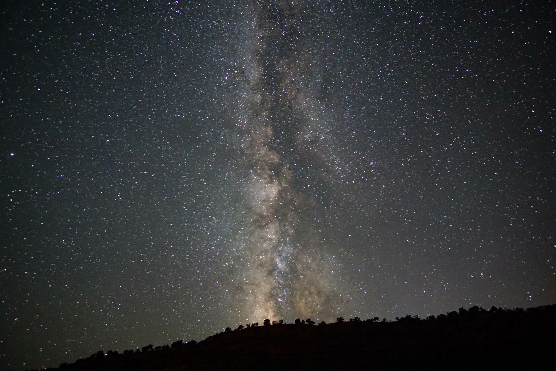 The milky way galaxy is visible in the night sky