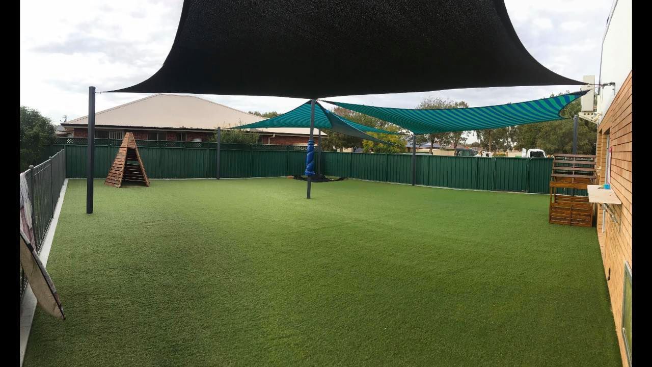 Synthetic Grass At The Back Of the School — Landscaping Services in Dubbo, NSW